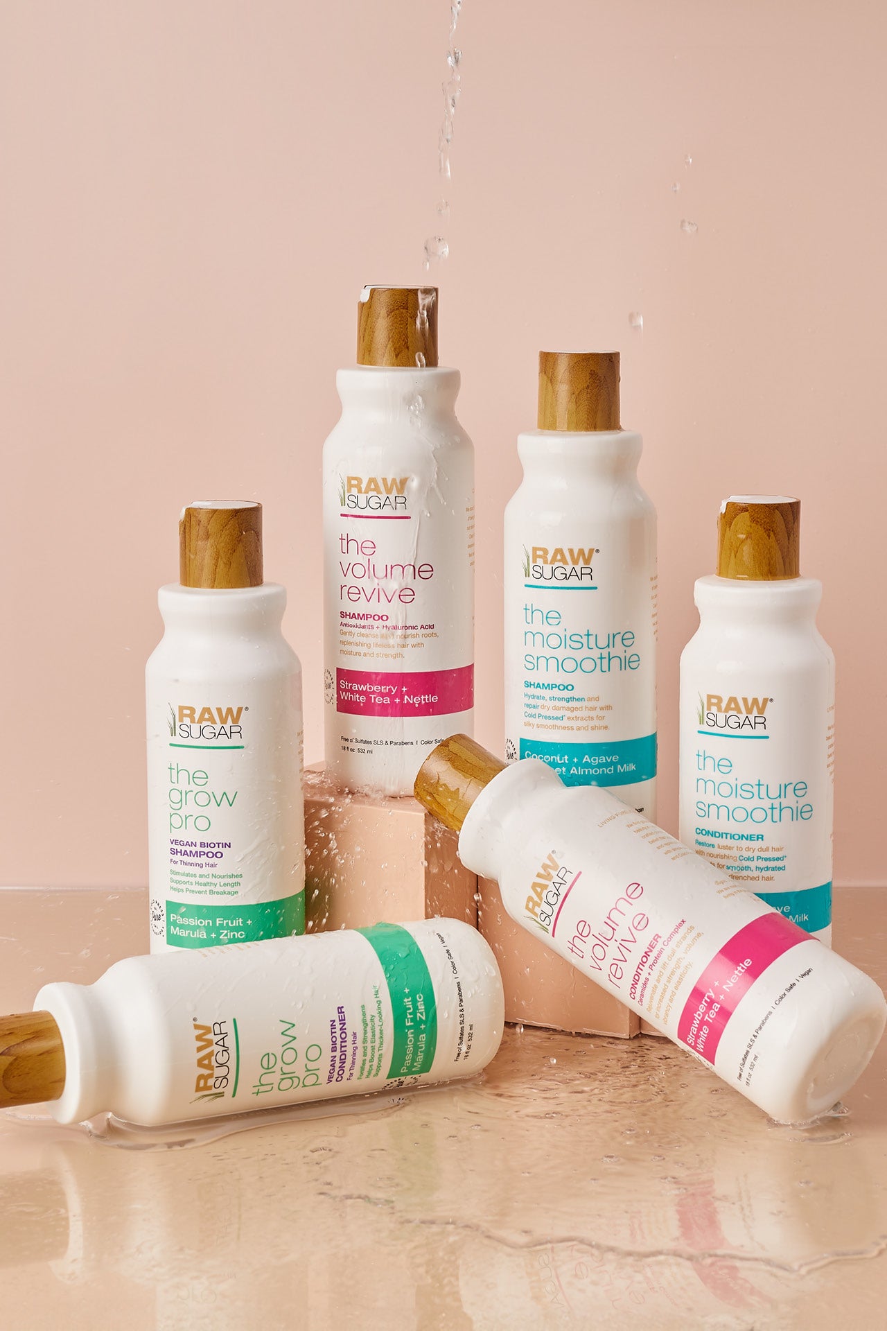 shampoo and conditioners together on risers and with water