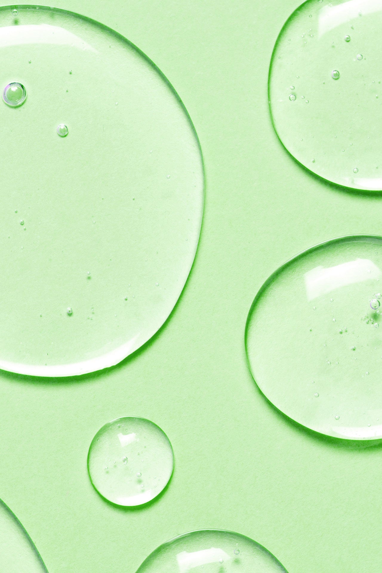 Fresh water drops on a light green background